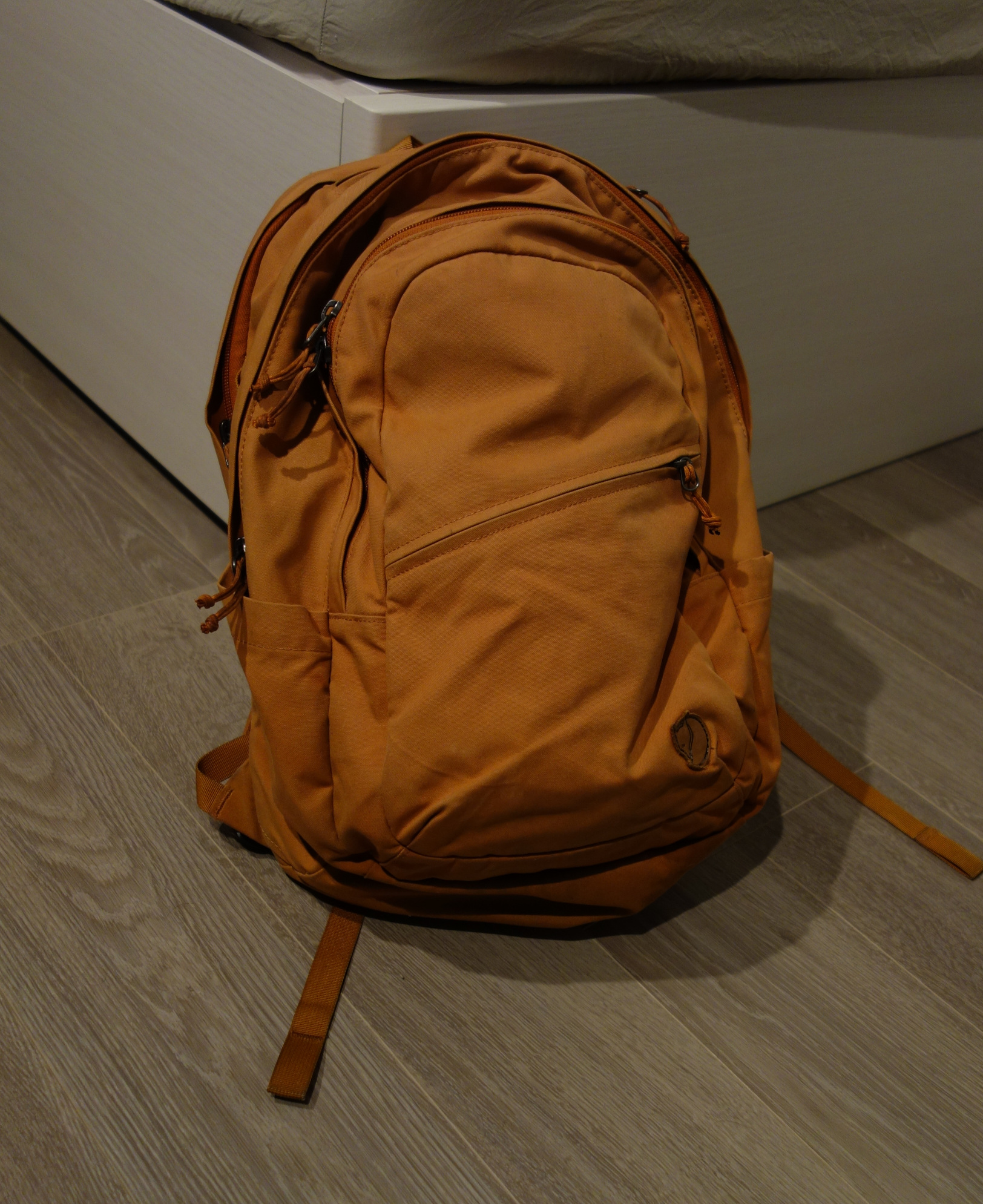 Picture of my orange Fjällräven Räven 28 backpack.